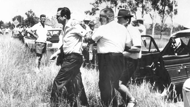 A distraught Bill Mackay at the site near Townsville where the bodies of his daughters Judith, 7, and Susan, 5, were found in August 1970.