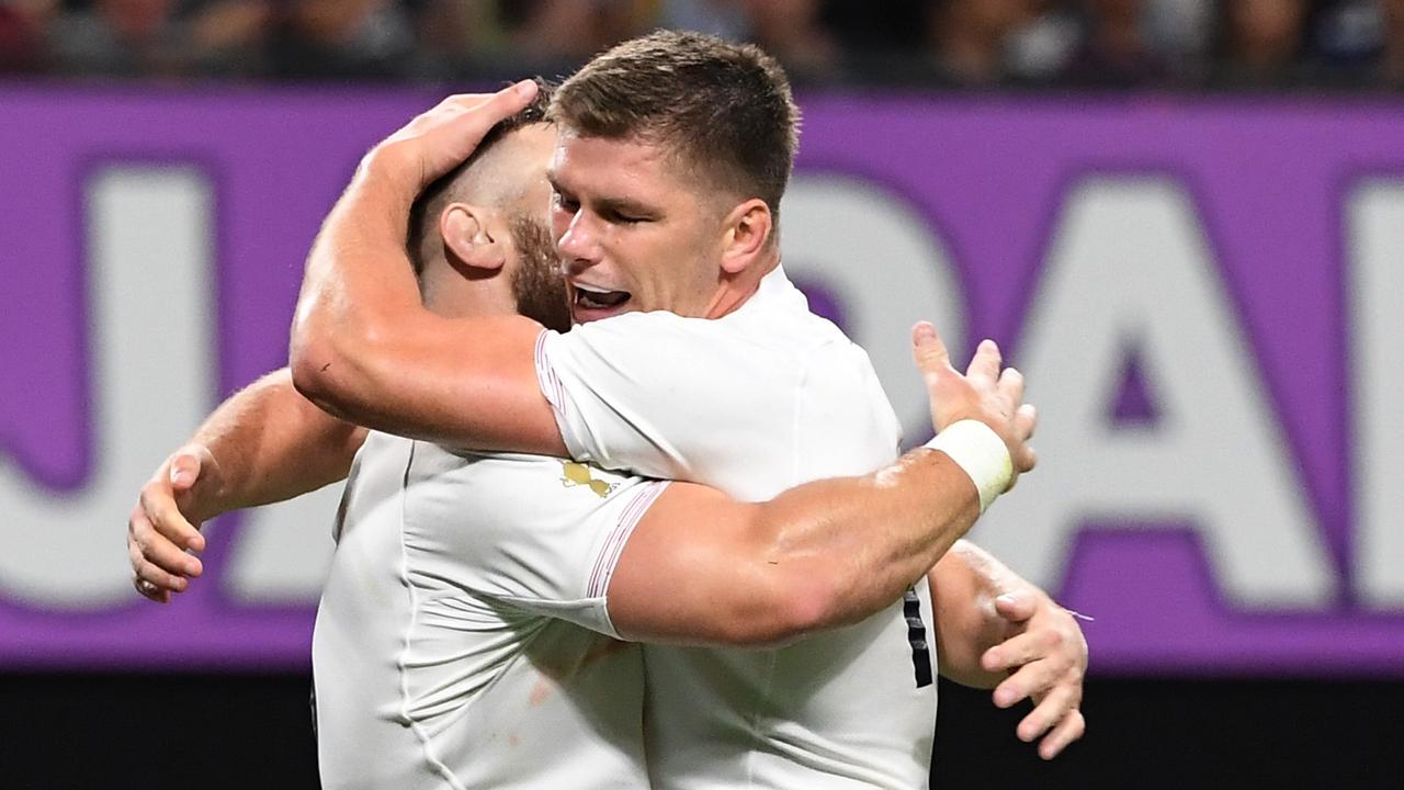 England's hooker Luke Cowan-Dickie (left) celebrates with England's centre Owen Farrell after scoring a try.