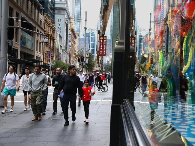 SYDNEY, AUSTRALIA - NewsWire Photos - APRIL 17 2023 - People are seen walking past the Luxury Luis Vuitton Retail Store in central Sydney as the latest financial data shows Aussiesâ online spending dropped by more than $124 million nationwide. Picture NCA NewsWire / Gaye Gerard