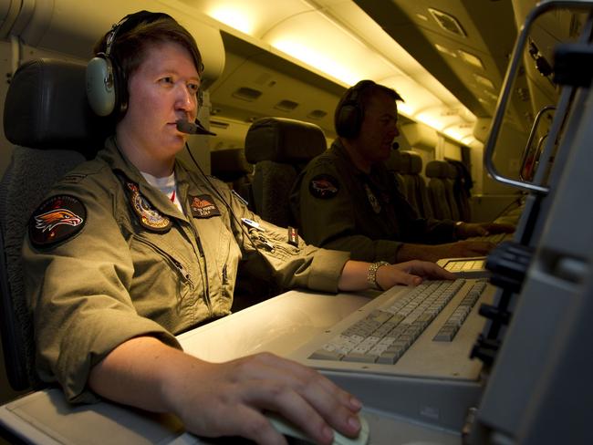 Flying Officer Elizabeth Vonfinster aboard RAAF E-7A Wedgetail Airborne Early Warning and Control aircraft during its return from another mission in the search for MH370. AFP Photo/Australian Defence/Cpl Colin Dadd