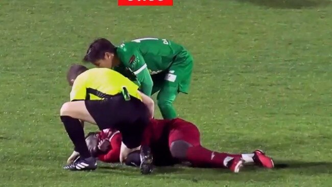 Adelaide United's Nestory Irankunda tripped over and fell awkwardly to the ground, clutching his throat, Referee Dr Christian Verdicchio, noticed this, and quickly used his expertise to ensure the player didn't swallow this tongue. Picture: Supplied