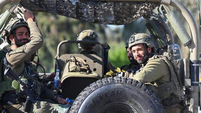 IDF soldiers drive in military vehicles on October 15, 2023 in Sderot, Israel. Israel has sealed off Gaza and launched sustained retaliatory air strikes, which have killed at least 1,400 people with more than 400,000 displaced, after a large-scale attack by Hamas. Picture: Alexi J. Rosenfeld/Getty Images