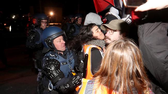 Police clash with protesters outside the venue hosting Canadian conservative commentator Lauren Southern. Picture: David Geraghty