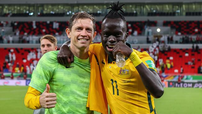 Socceroos Craig Goodwin (left) and Awer Mabil hope to be celebrating after Australia’s match against Peru. Picture: KARIM JAAFAR / AFP