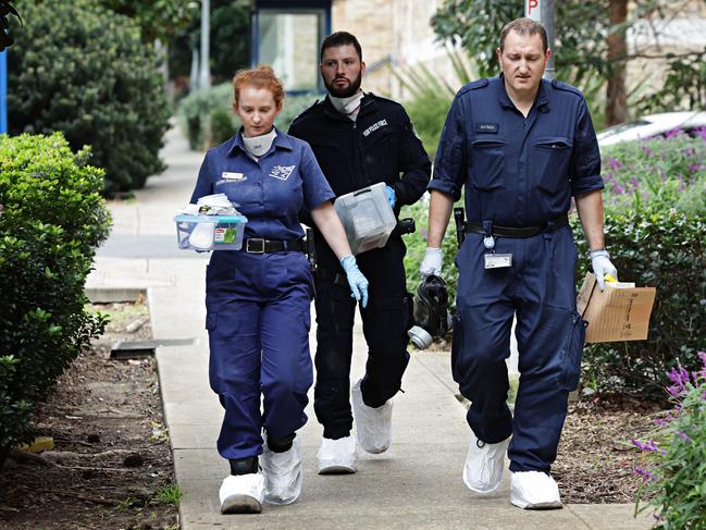 DAILY TELEGRAPH JUNE 1, 2023. Forensic police entering the apartment block where a three-year-old boy was found deceased and a man critical injured in Riverwood. Picture: Adam Yip