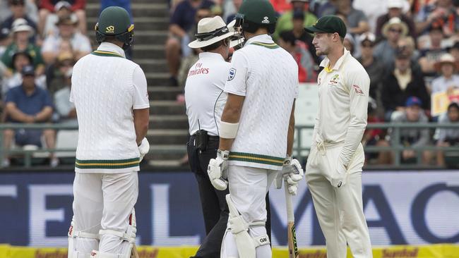 Cameron Bancroft is questioned by umpires regarding the ball tampering. Picture: AP.