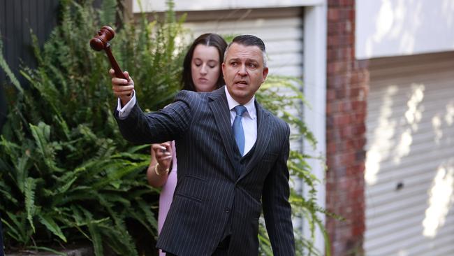 Auctioneer Clarence White during an auction at 18/20 Ocean Ave, Double Bay. Picture: Tim Hunter