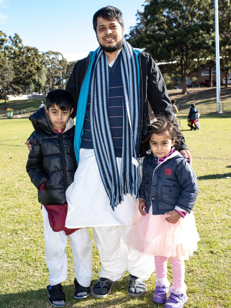 Ali Zafar of Valley Park with Hassan Ali, 7, and Fatima Ali, 3, at Eid al-Adha festival at Roberts Park, Greenacre. Picture: Julian Andrews. Photos can be purchased at newsphotos.com.au