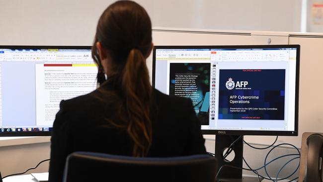 An employee works at a computer terminal in the Australian Centre to Counter Child Exploitation (ACCCE). Picture: AAP