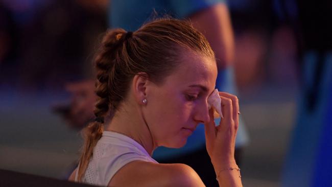 An emotional Petra Kvitova wipes away tears following her loss to Naomi Osaka.