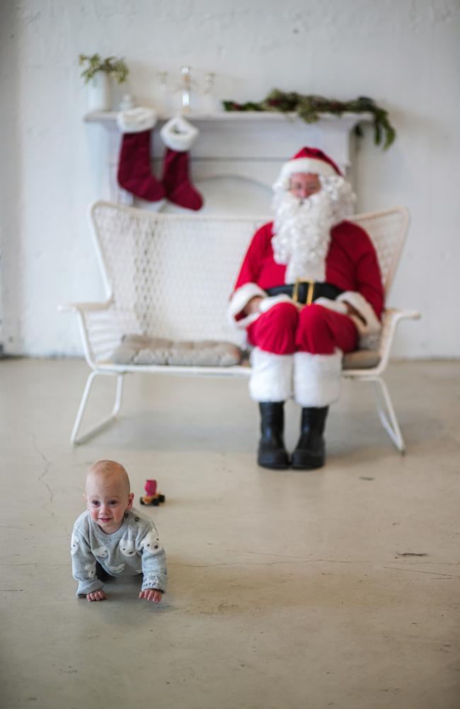 After being born prematurely last year, little William Foon is continuing to defy the odds and is now thriving at 17 months despite a challenging start to his life. Pictured here with Santa Claus. Picture: Rosella Pike