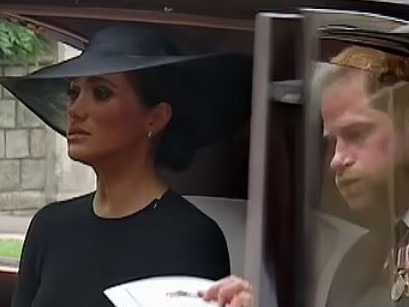 Prince Harry lets out a gasp as he and Meghan Markle leave St. George's Chapel at Windsor castle after the Committal Service for Queen Elizabeth II.