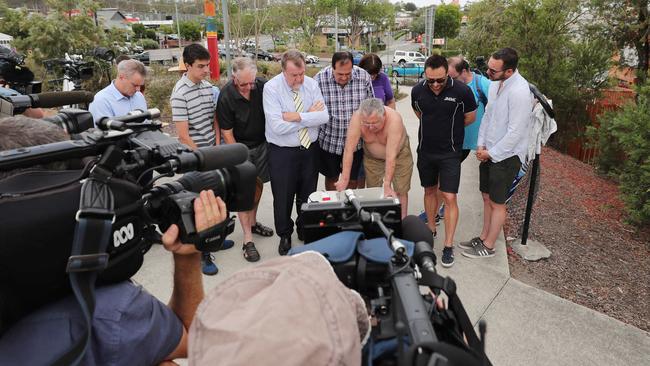 Good residents and Paul Tully listen to the judgement of the 2011 flood class action.  Picture: Peter Wallis