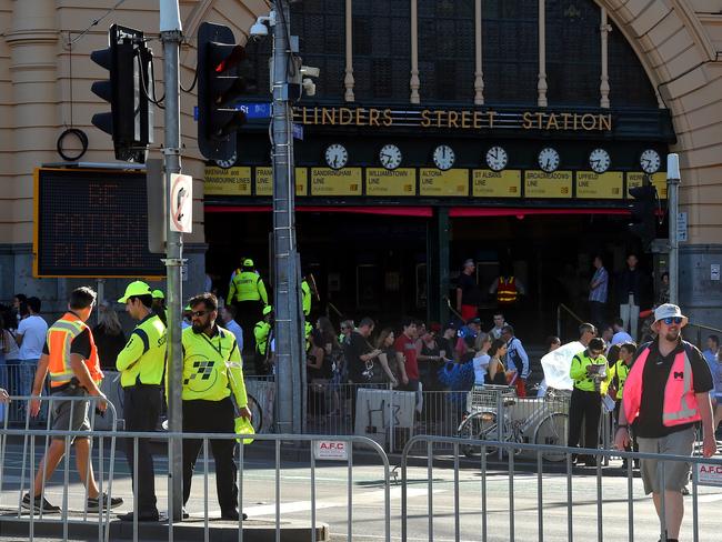 Security barriers are erected at Flinders St station. Picture: Jay Town