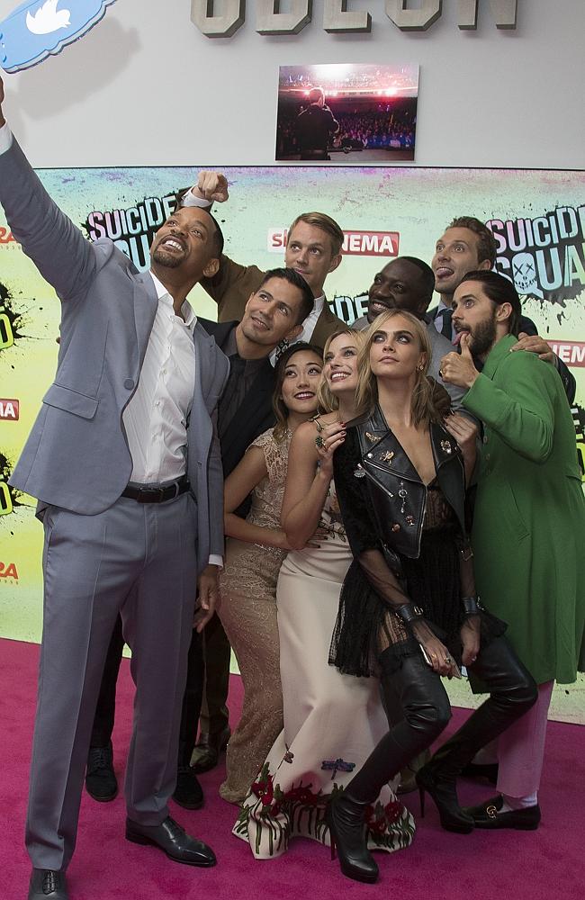 Will Smith, Jay Hernandez, Joel Kinnaman, Karen Fukuhara, Margot Robbie, Adewale Akinnuoye, Cara Delevingne, Jai Courtney and Jared Leto pose for a selfie at the European Premiere of “Suicide Squad” at the Odeon Leicester Square on August 3, 2016 in London, England. Picture: AP