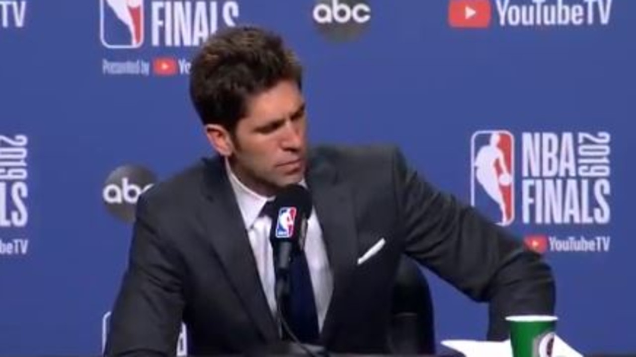 Bob Myers chokes back tears.