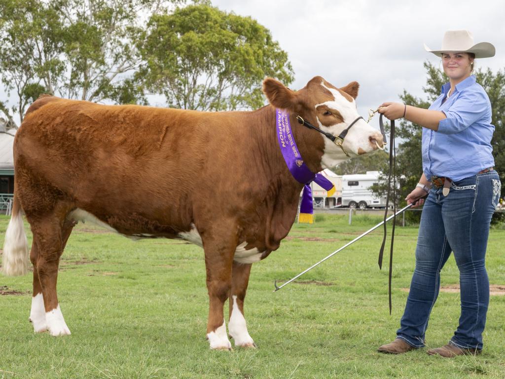 Lilly Wingfield with Trinity Vale Rebel Jaxon winner of 1st Junior Champion Simmental at the Toowoomba Royal Show. Saturday, March 26, 2022. Picture: Nev Madsen.