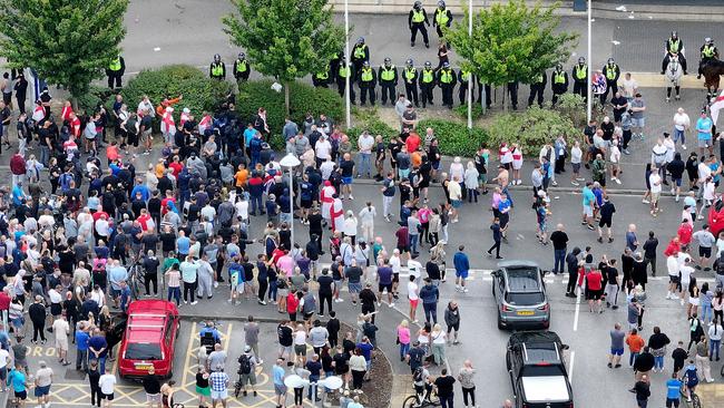 An aerial view of anti-migration protesters outside of the Holiday Inn Express on August 4. Picture: Christopher Furlong/Getty Images