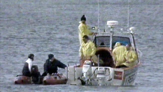 Rescue workers search for the body of missing former AFP officer Scott Beynon off Torquay Beach. Picture: Channel 9