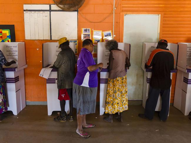 People at a mobile polling booth at Warruwi on Goulburn Island earst of Darwin on the first day of mobile polling for the 2013 federal election. The Australian Electoral Commission is taking a number of steps to improve indigenous voter participation.