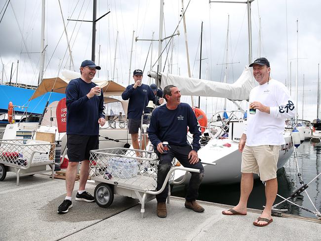 The original Wild Oates yacht crew (L-R) Muir Watson, Drew Bagnall, Marc Skjellerup, owner Gordon Smith and skipper and owner Brett Eagle having a beer and packing up due to the Sydney to Hobart Yacht Race being cancelled because of COVID. Jane Dempster/The Australian.