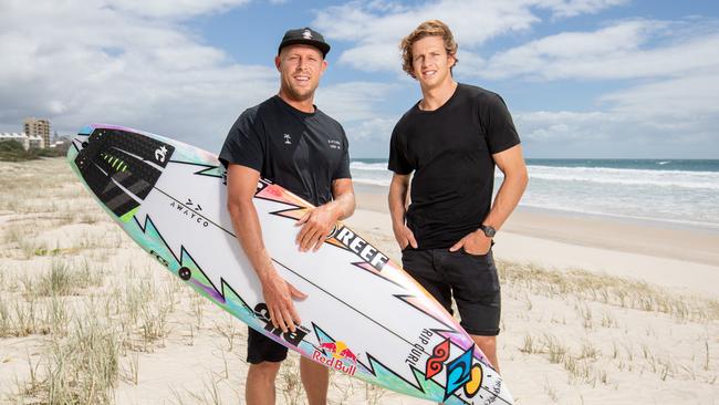 Fremantle captain Nat Fyfe pictured with surf legend Mick Fanning. Picture: by Luke Marsden.