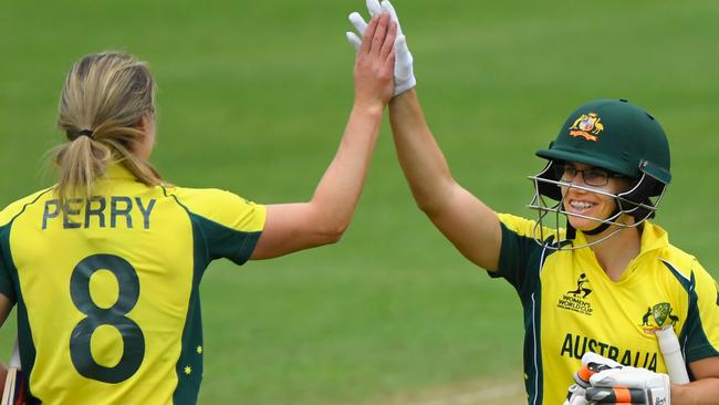 Australia batsman Nicole Bolton (r) and Ellyse Perry celebrate victory during the match between Australia and West Indies.