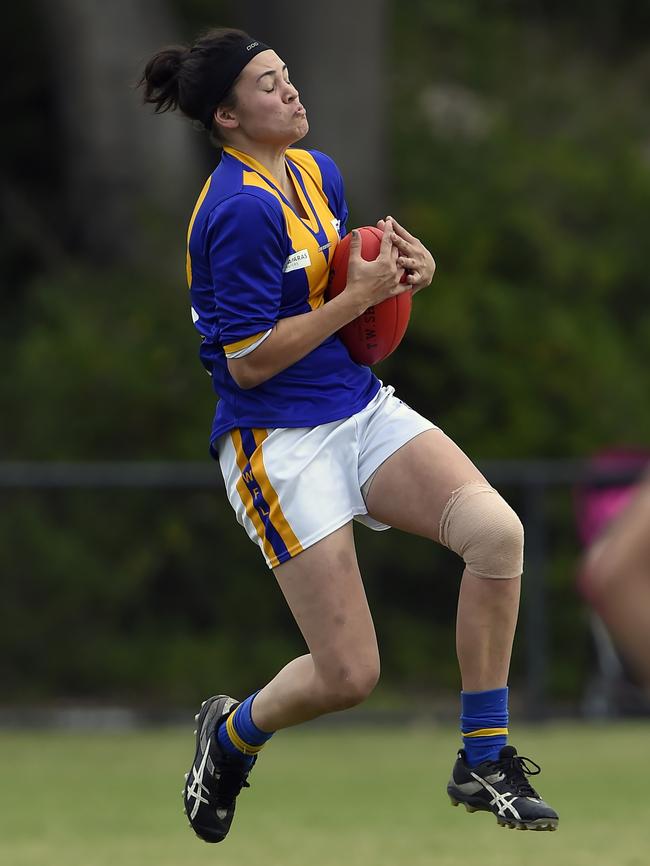 Cranbourne's Danielle Hardiman takes one of many marks against Seaford on Sunday. Picture: Andy Brownbill