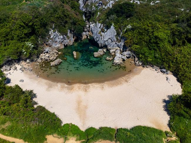 2R68FNJ Aerial view on small Playa de Gulpiyuri, flooded sinkhole with inland beach near Llanes, in Asturias Northern Spain, around 100 m from Cantabrian Sea,  Picture: Alamy   Picture: Alamy
