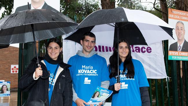 Maria Kovacic’s nieces and nephews Alana, Nick and Carla Kovacic support their aunt at the Granville polling booth.