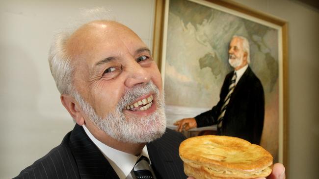 SA business owner, baker Vili Milisits with a portrait painted by Dale Fu Chen for the Archibald national portrait competition.