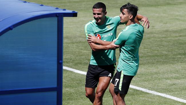 Tim Cahill and Daniel Arzani muck around during training. Picture: Toby Zerna