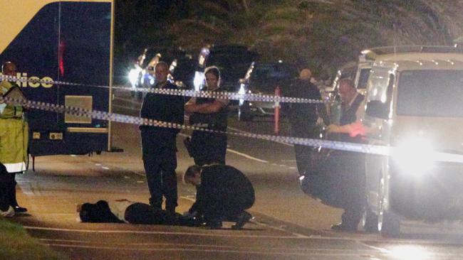 Police examine the scene on the night Les Samba was shot dead possibly by two hitmen in Beaconsfield Pde, in the Melbourne suburb of Middle Park. Picture: Trevor Pinder