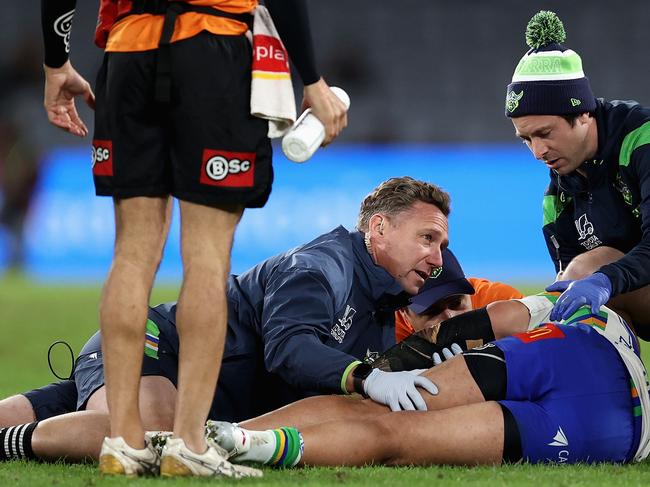 Corey Harawira-Naera of the Raiders receives attention after collapsing on the field during a 2023 NRL match between South Sydney Rabbitohs and Canberra Raiders. Picture: Brendon Thorne/Getty Images