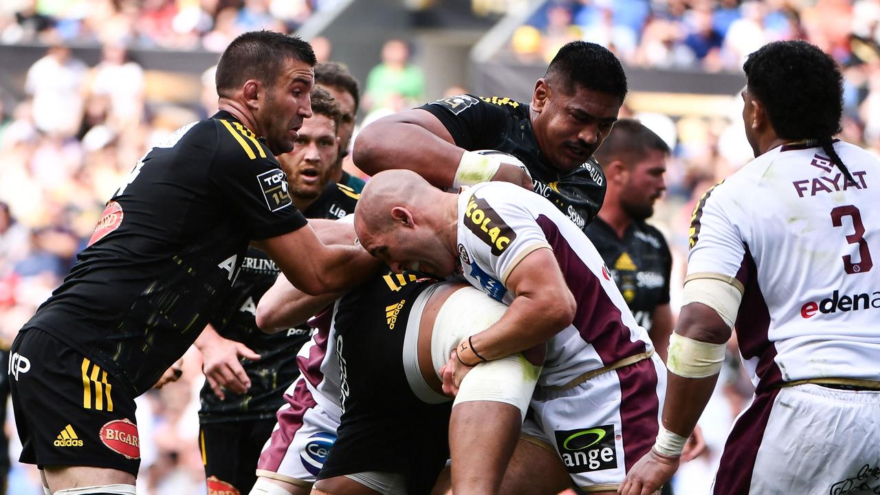 La Rochelle's Will Skelton (centre) is tackled by Bordeaux's Maxime Lucu) during a French Top 14 semi-final. Picture: Gaizka Iroz / AFP