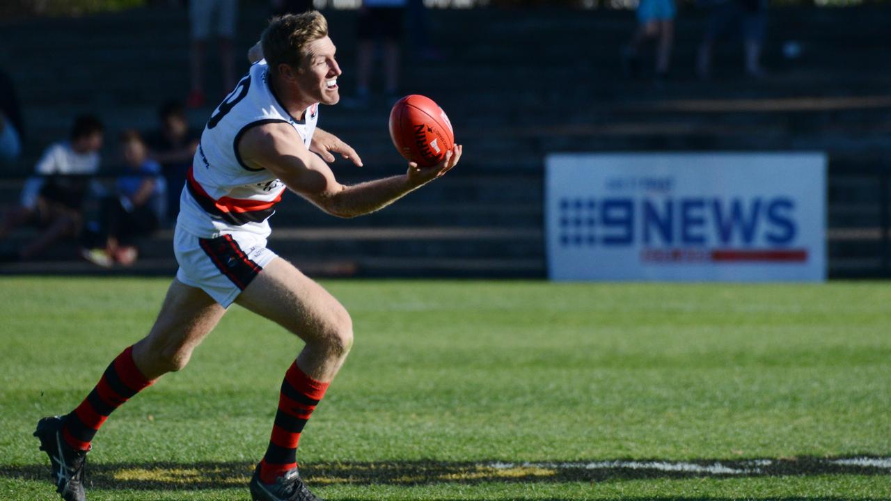 Adelaide Footy League, Division 1 Grand Final Tea Tree Gully v Rostrevor at Thebarton Oval, Saturday, September 22, 2018. Michael Coad from Rostrevor juggles the ball. (AAP Image/ Brenton Edwards)