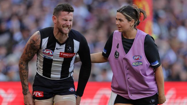 Jeremy Howe winces in pain after a big bump by Charlie Cameron that resulted in broken ribs. Picture Lachie Millard