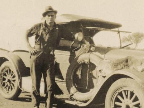 Upfield2 - “Snowy” Rowles stands beside James Ryan’s Dodge, taken by Arthur Upfield. Picture: National Library of Australia