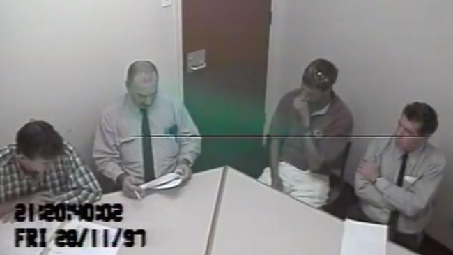 Robert Hytch (second from right) is interviewed by police following the disappearance of Rachel Antonio. Supplied