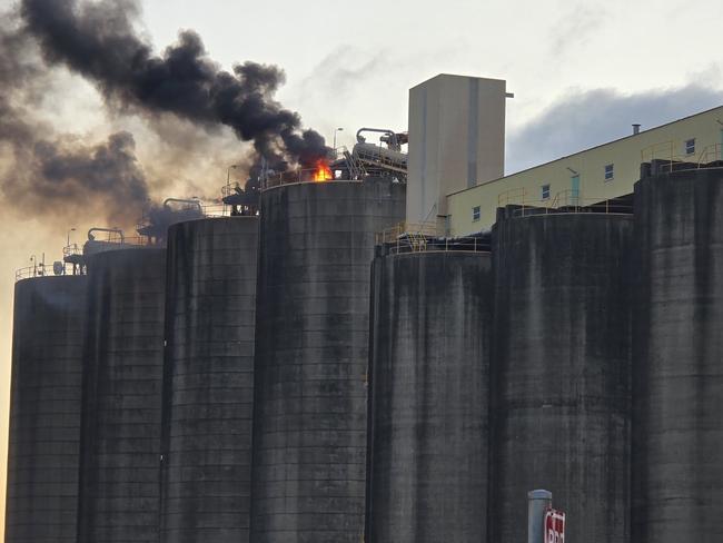 View from the north carpark of GrainCorp's silo on fire in the Mackay Harbour. Picture: Ian Nelson