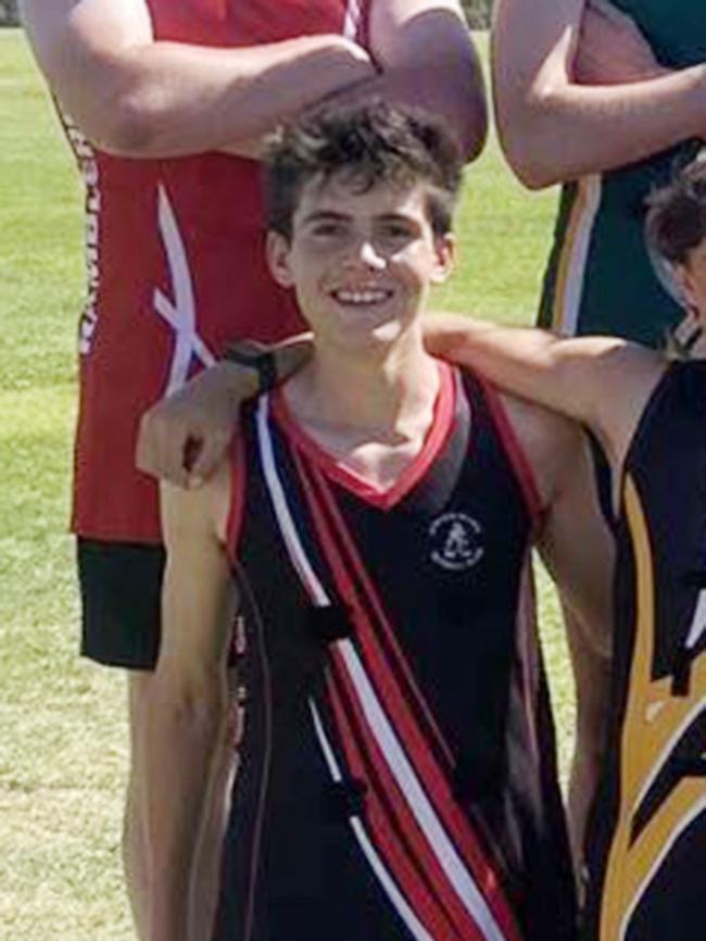 The team Tyson Freund captained in the U18s gathered around his guernsey to pay tribute to the 18-year-old. Picture: Supplied
