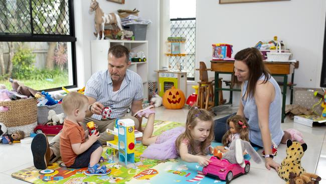 Relaxing: Alan Jones and Sophie Andrews, with children Owen, one, and Eleanor, five, plan to find a home with some acreage to buy on the Sunshine Coast. Picture: Russell Shakespeare