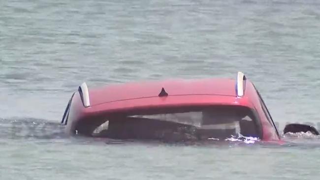 The small red car was found submerged in the ocean south of the Cervantes Jetty later on Tuesday morning, where a 20-year-old man had to be rescued from the water. Picture: 7News