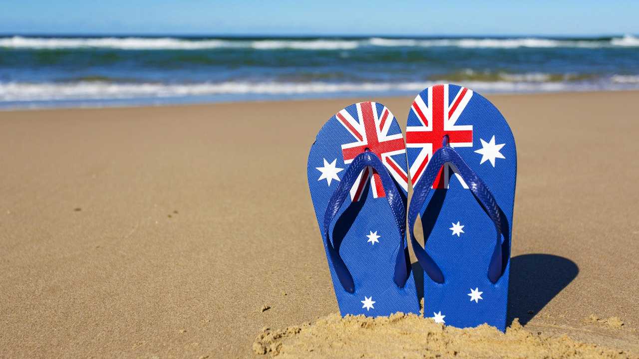 Australian flag flip flop thongs on a beach. Picture: davidf