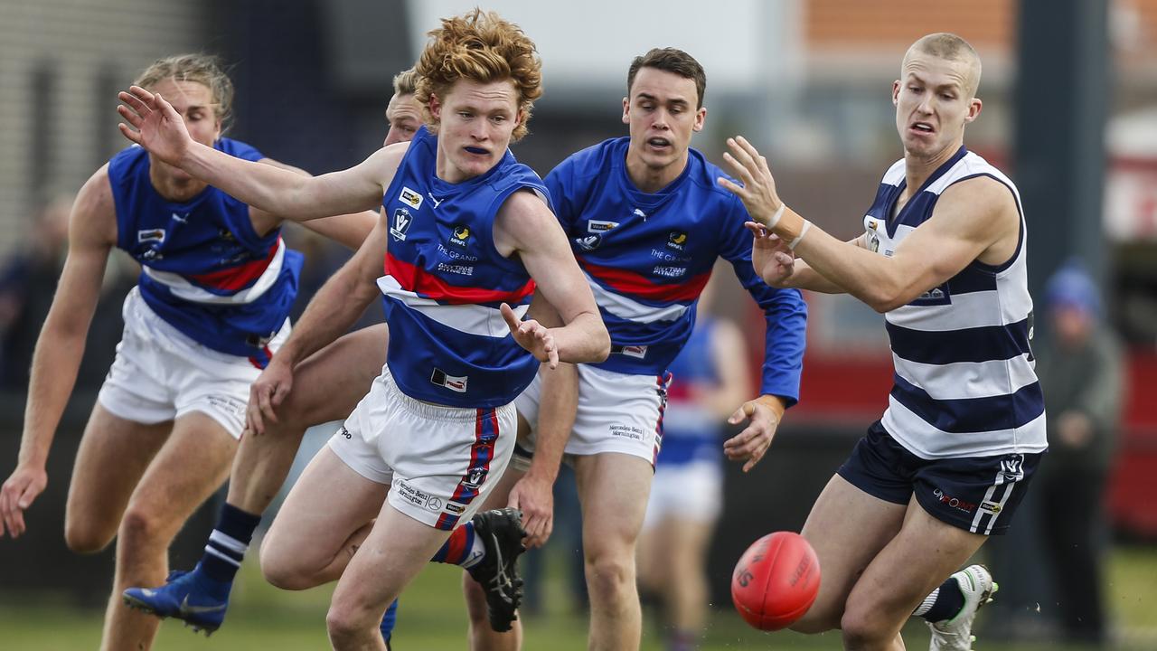 MPNFL: Mornington’s Matthew Caine and Jesse Davies of Chelsea race for the ball. Picture: Valeriu Campan