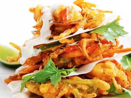 Vegetable pakora salad with fruit chutney yoghurt.