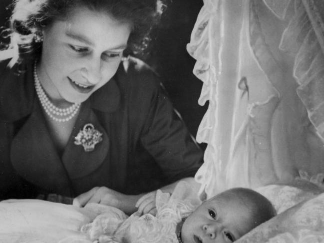 A newborn Prince Charles lies in his cradle in 1948.