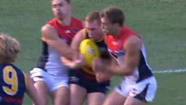 Jack Viney (right) connects with Tom Lynch.