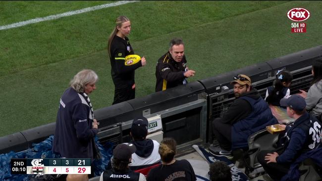 Officials investigate the crowd act.