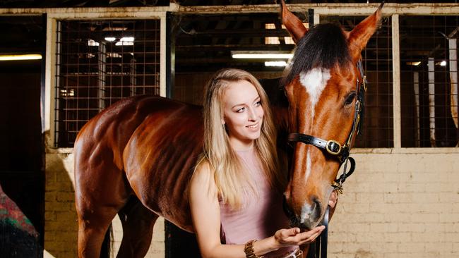 Strapper Louise Day with racehorse Clearly Innocent at Newcastle Racecourse.